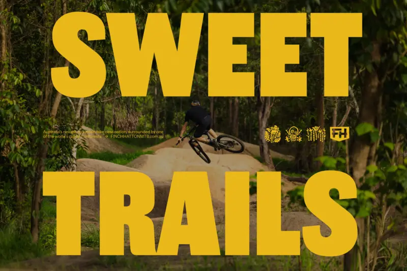 Finch Hatton headline, trail icons and call to action, with image of mountain biker